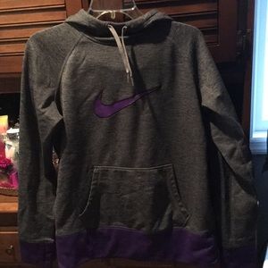 Grey Nike sweatshirt with purple Nike sign